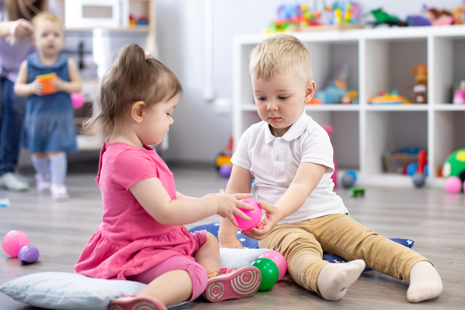 Young children playing together in a preschool setting.